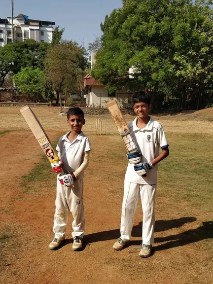 Two young batsmen who successfully finished the match for their team. Learning to stay not out and see the team across the finish line is a key sign of a developing cricketer.