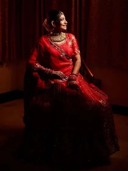 A dramatic, low-light portrait of the bride, creating a regal and timeless image.