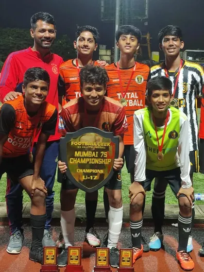 Our U17 champions posing with their coach and trophy at the Mumbai 7s Championship Cup.