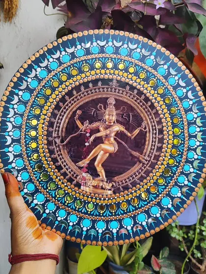 This is a dot mandala art piece featuring Nataraja, the dancing form of Shiva. The process of creating the thousands of tiny dots felt like a form of meditation.