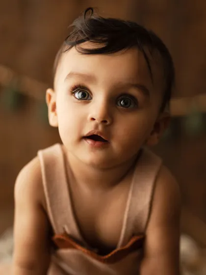 A stunning close-up of a baby's beautiful eyes. Milestone sessions are the perfect opportunity to capture these captivating details.