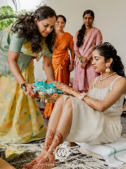 For this Haldi, we focused on a vibrant yellow theme with rustic touches. We used hanging cane baskets filled with yellow flowers, lush greens, and traditional brass urlis to create a warm and sunny celebration.