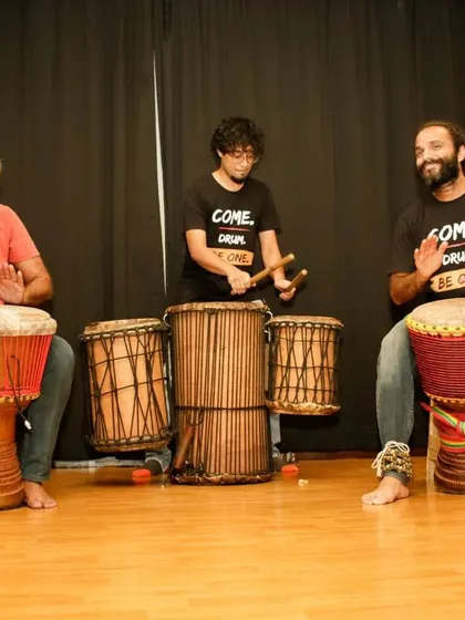 Three of our drummers, deep in a performance. The skills learned in our classes can be a stepping stone to our facilitator course, where you learn to lead groups with rhythm.