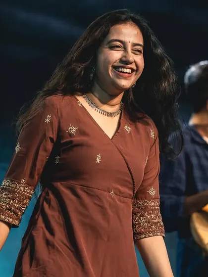 A candid smile backstage. It's the little moments of joy and laughter with my band that make this journey so special.