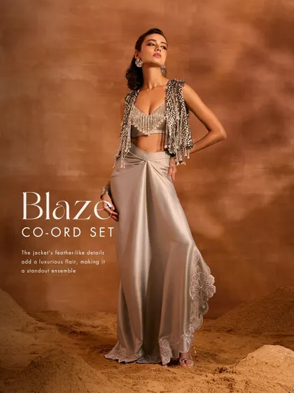 The Blaze Co-ord Set, adorned with hand-embellishments. I paired a tassel-embellished jacket and blouse with a flowing satin draped skirt for a standout, luxurious look.