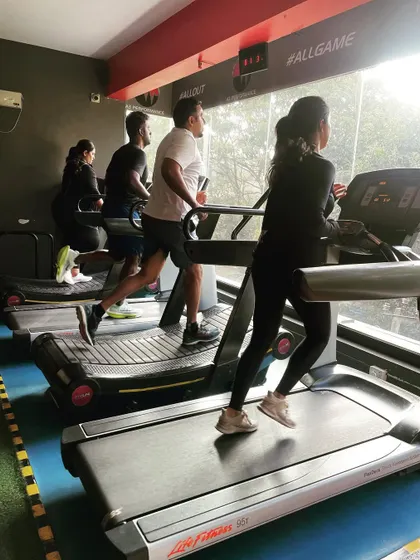 A group of clients runs on the treadmills, a common sight during our warm-ups and conditioning finishers.