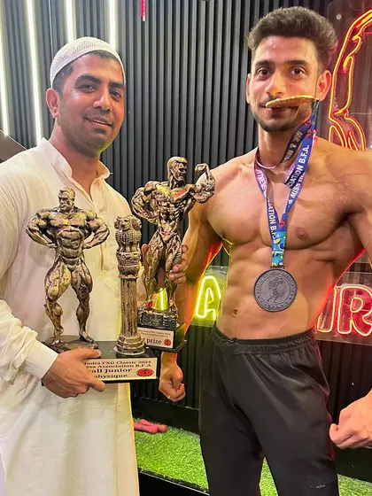 My junior men's physique athlete, Yahya, after winning the gold medal and overall title at Mr. India. The future of Team Iron is bright.