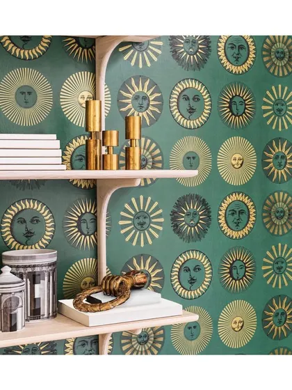 This 'Soli' wallpaper, with its radiant golden suns against a rich emerald green, is a perfect example of how a repetitive graphic motif can turn a wall into a captivating feature. It's an excellent choice for adding a touch of vintage glamour.