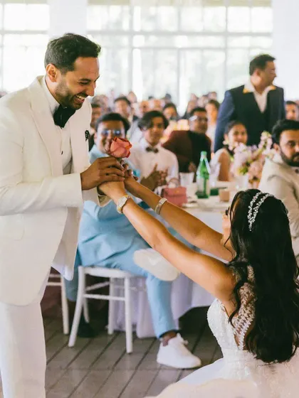 Who says only the groom can go down on one knee? I love breaking traditions, and this moment from the bride's solo performance, where she presents a rose to her groom, was a beautiful and modern expression of her love.