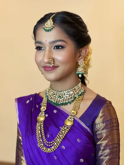 Wrapped in the serenity of purple, this young client exudes an aura of tranquility and grace.