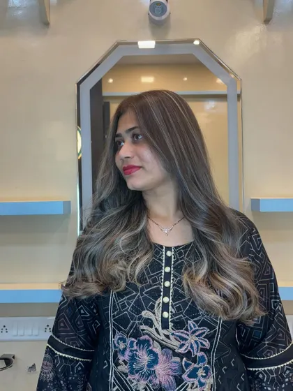 After the transformation. I corrected the previous color and created this beautiful ash blonde balayage. The waves add movement and show off the seamless blend of the highlights.