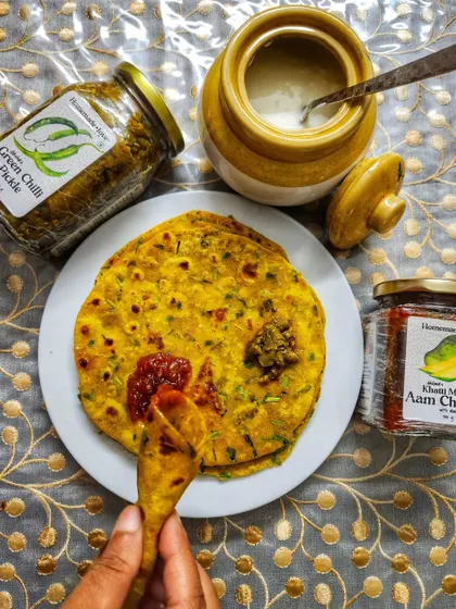The best condiments for Methi Thepla are definitely our Khatti Meethi Aam Chutney and Green Chilli Pickle. The sweet and tangy chutney and the spicy pickle both pair beautifully with the theplas.