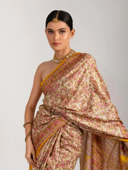 For this traditional look, precision was key. I crafted a classic winged eyeliner and a neat, elegant low bun to complement the floral saree. This showcases my ability to create timeless and graceful ethnic looks for shoots and campaigns.