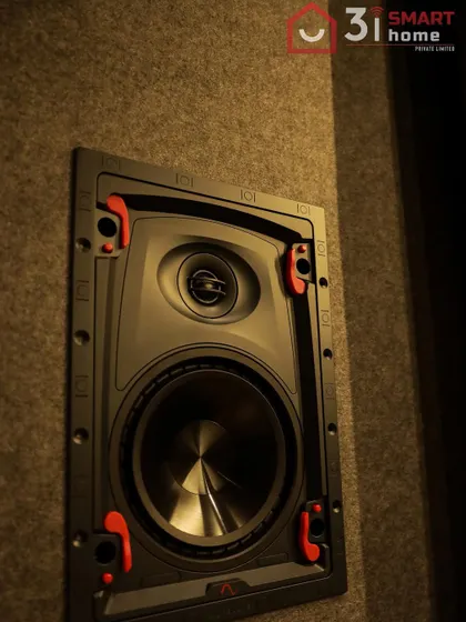 A detailed shot of an Episode Signature 3 Series In-Wall Surround Speaker. These high-performance speakers are designed to be heard but not seen, providing immersive audio from a discreet installation.