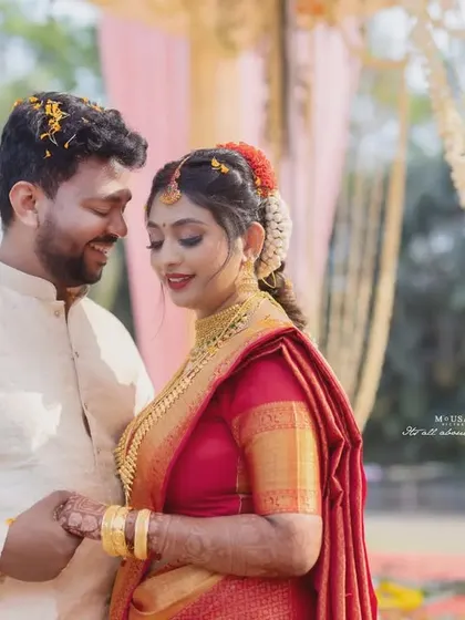 A South Indian couple holds hands, sharing a loving look after their ceremony. This frame beautifully echoes the beginning of their forever.