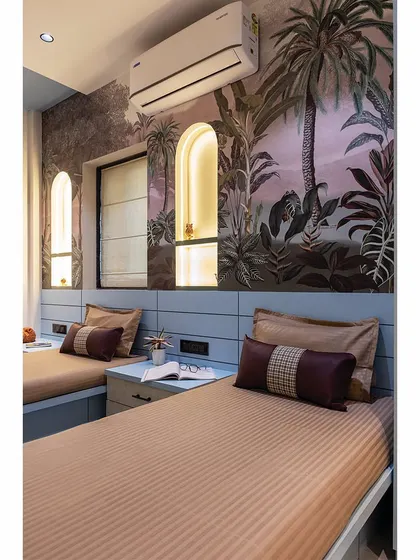 A close-up of the kids' room after transformation, showing the beautiful arched niches and botanical wallpaper.