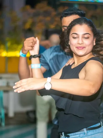 A dynamic hair swirl during a fast turn. The energy and movement are what make Salsa so exciting.
