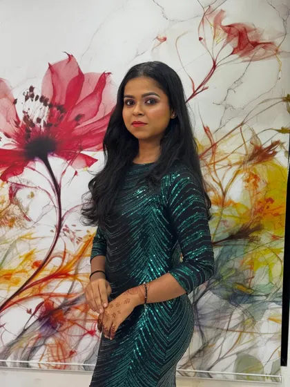A confident pose showing off soft, wavy hair perfect for a party or special occasion. This simple yet elegant hairstyle is versatile and suits many different outfits.