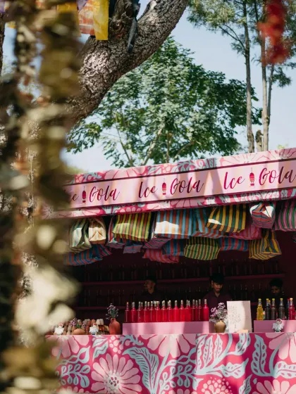 A whimsical "Saturday Market" themed event in Udaipur, with custom-designed stalls for a Chai House, Frozen Yoghurt, and Ice Gola, complete with unique branding and playful decor.