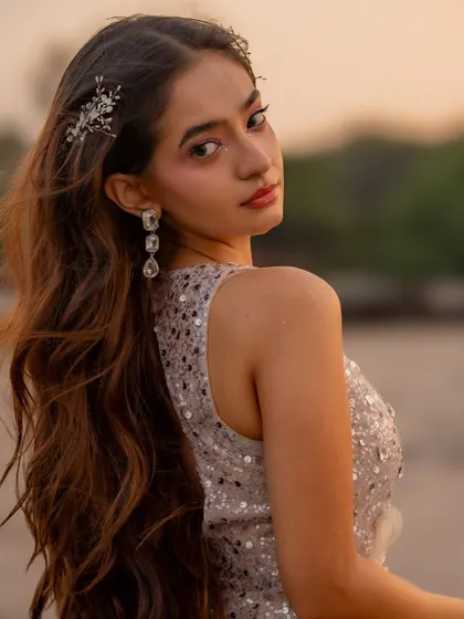 A close up of Anushka Sen's look for her music video. The styling included delicate crystal hair accessories and drop earrings to enhance the ethereal, fairy-like theme.