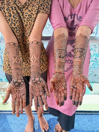 Mehendi for the bride and her sister. I can create coordinated designs for the whole family, and I can bring a team to help for large groups.