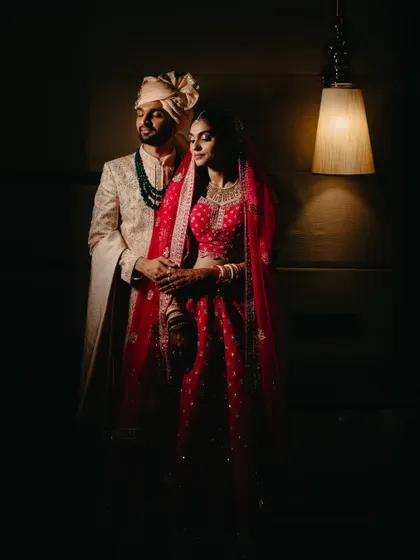 A dramatic, low-light portrait of the couple. We use creative lighting to create moody and cinematic images that feel like a movie still.