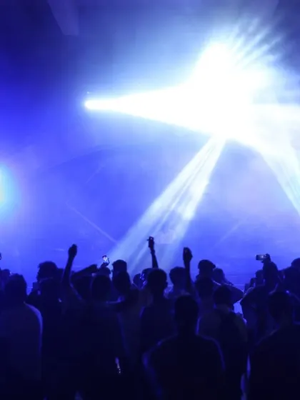 Another angle of the audience enjoying the show, with phones up to capture the moment.