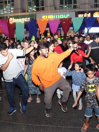 Dancing with the kids and adults at Zinng Fest. It's a family-friendly event.