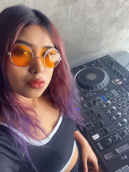 A selfie with my gear before my Sunday brunch set at Moxy. I love the contrast of my purple hair with the orange glasses.