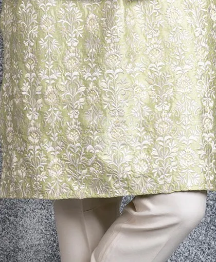 A final detail shot of the embroidered hem of our mint green kurta.