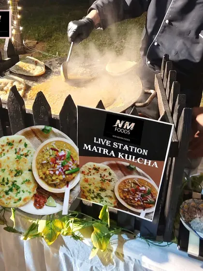A taste of authentic Delhi street food, made live at your event. This is our Matra Kulcha station, where soft, fluffy kulchas are served hot off the tawa with flavorful matra, bringing a rustic and beloved culinary experience to your celebration.