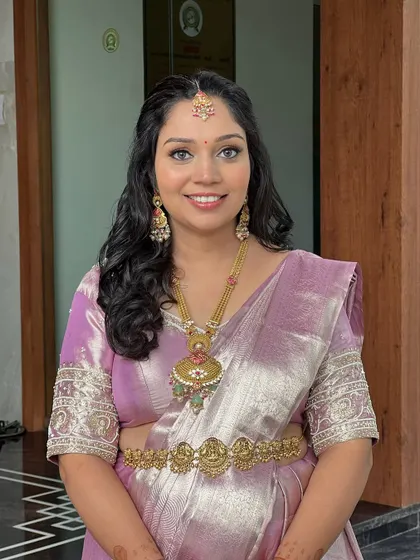 Another angle of this soft and elegant baby shower look, focusing on the flawless makeup.