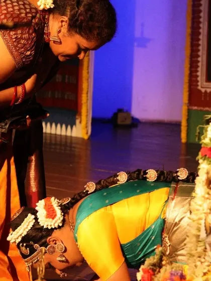 A student seeking my blessings on stage. The Guru-Shishya parampara is the foundation of our artistic lineage.