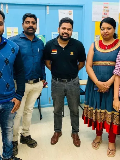 A proud teacher with his German language students. We celebrate every milestone with our learners on their path to fluency.