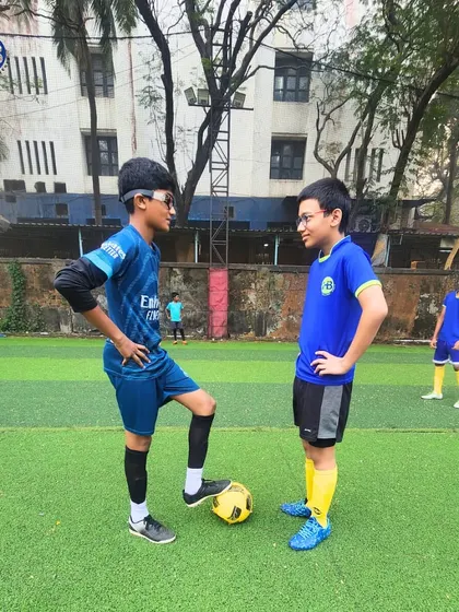 A moment of sportsmanship and friendly rivalry on the football turf. Our programs encourage healthy competition and mutual respect among players.