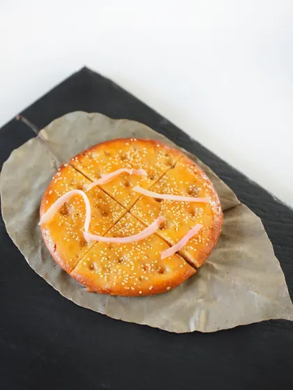 Aromatic saffron bakarkhani, a rich, layered bread, served alongside our haleem as part of the Ramzan feast.