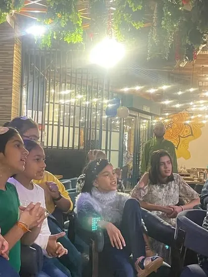 The audience watches with anticipation. My shows are designed to captivate a wide age range, from young children to their parents and grandparents.