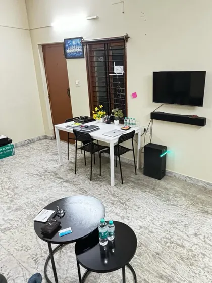 **Work and Relax: Bangalore Office View.** A look at the workspace and lounge area in our new Bangalore office, designed for both productivity and comfort.