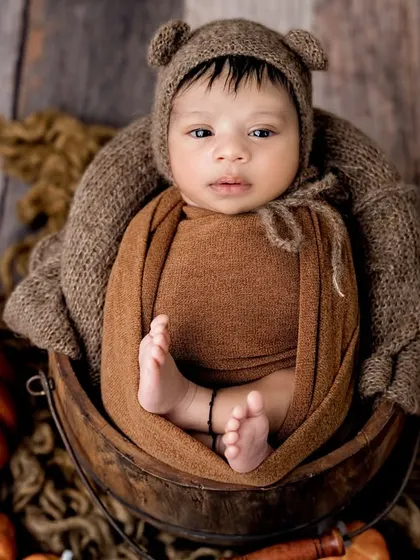 This little bear is awake and curious. I love capturing babies' alert expressions and wide-open eyes.