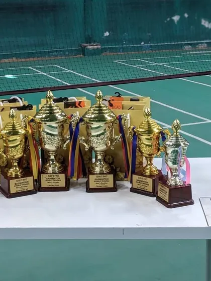 We believe in rewarding hard work. A lineup of the impressive trophies for our Badminton Double Trouble champions.