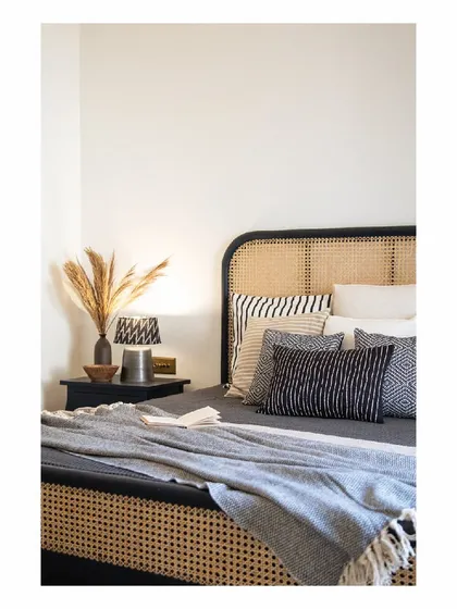 A holiday bed should feel like an escape. We designed this bed with a full-length cane headboard and a simple black frame, paired with layers of soft, textured linens. It’s a simple, elegant piece that invites you to relax and unwind.