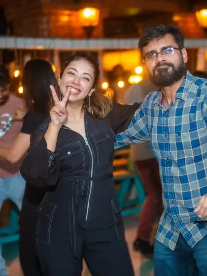 A peace sign and a huge smile. It’s all about good vibes and happy times at La Rumba.
