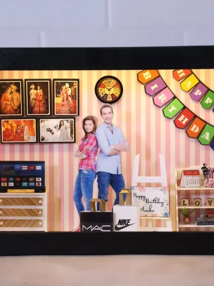 A birthday-themed miniature box with a 'Happy Birthday' banner, a mini laptop, and gift boxes, making it a perfect personalized birthday surprise.
