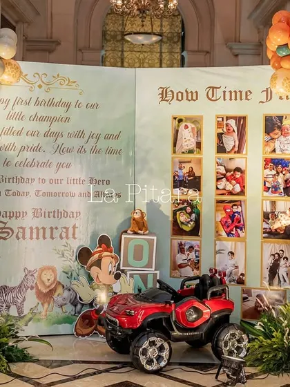 A beautiful milestone board designed as an open storybook, celebrating the 'little champion's' first year, complete with a mini ATV for photos.