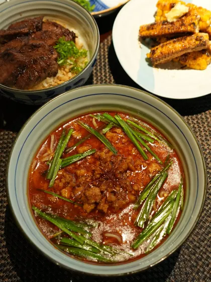 A full spread featuring our Taiwan Ramen, alongside our Sutēki Don and Grilled Corn. A perfect combination of spicy, savory, and sweet flavors.