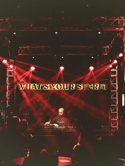 The stage is set at "The Secret Project," with the question "What's Your Secret?" glowing above me.