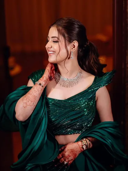 The bride's joyful smile says it all. This candid shot captures the happiness and confidence that comes with wearing a perfectly styled outfit.