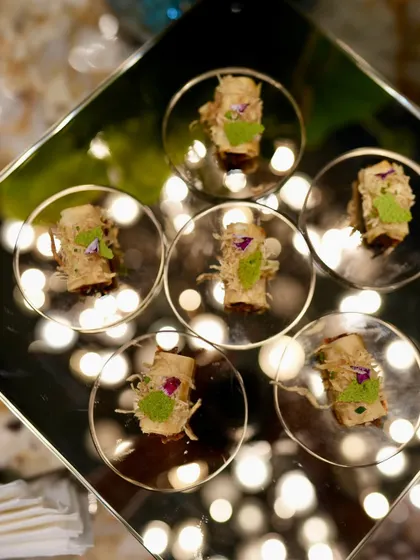 Truffle mushroom eclairs reflecting the ambient light at the Casa Mia launch, a perfect fusion of flavor and aesthetics.