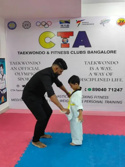 Tying a yellow belt.