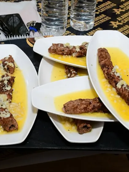 A tray full of our Butter Garlic Seekh, ready to be served. We prepare big batches to keep up with the demand for this popular dish.